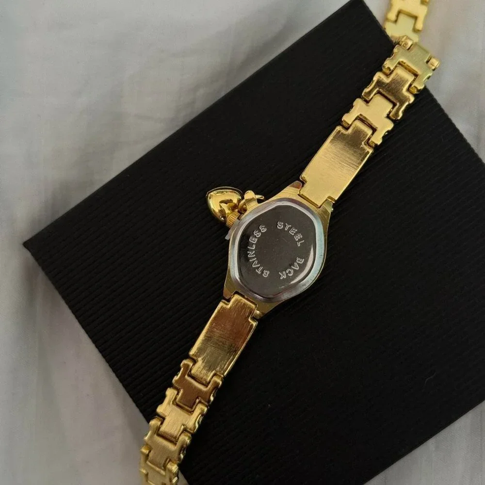 Sku:0346 vintage vibe gold mini watch + in‎ a gift box They fit any hand size